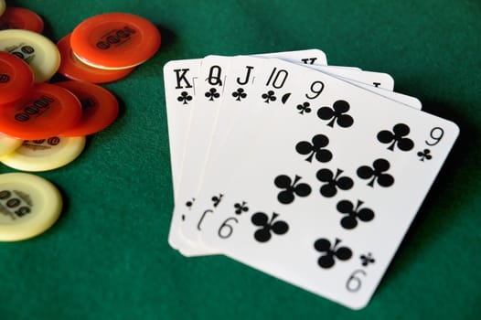 Cards and chips on green table