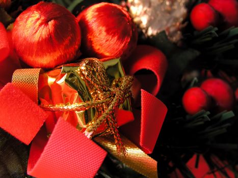 Red Christmas ornaments with golden reflections and ribbons
