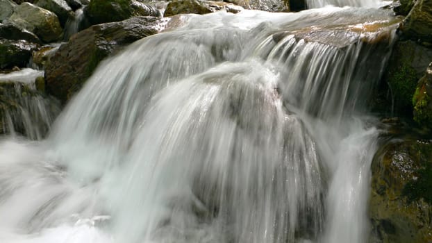 crystal clear river cascade on japanese mountain river