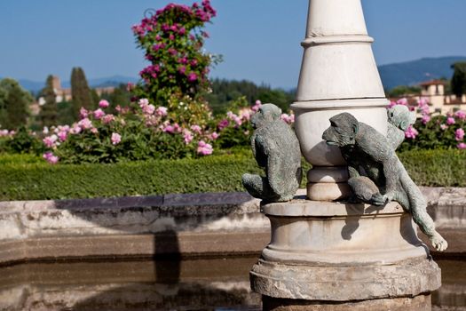 Monkey statue in a summer garden in Florence
