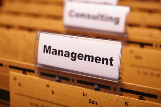 management word on business office folder showing leadership concept