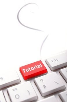 tutorial or e learning concept with key on computer keyboard