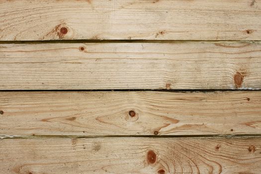 Four parallel wooden boards with insulation between them