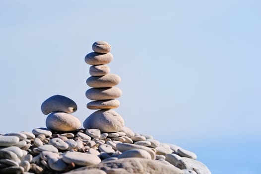 White Stack of zen stones on a sky background
