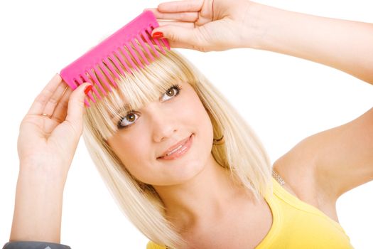 blonde girl combs her hair