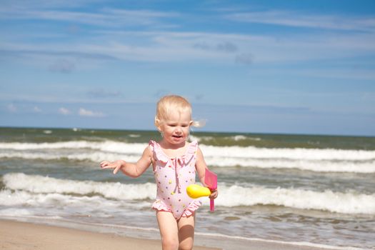 child run on the beach