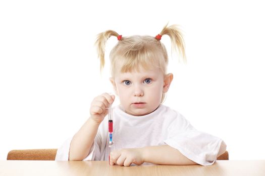 child playing as a scientist with syringe