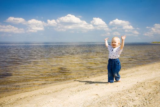 small girl over the blue sky near the river