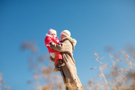 mom and child outdoors in winter