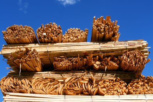 Close-up of a woodstack against a very blue sky