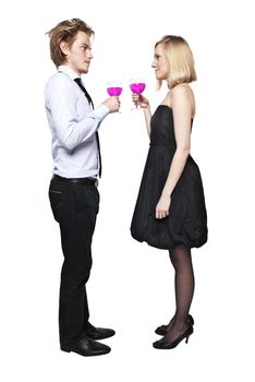 Young couple toasting with pink drink. Two people drinking. Studio photo., isolated.