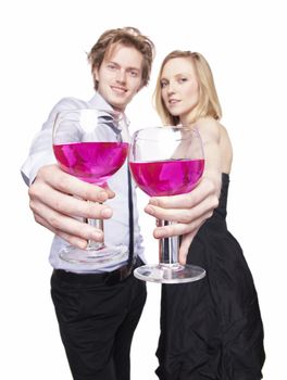 Young couple toasting with pink drink. Selective Focus. Studio photo, isolated.