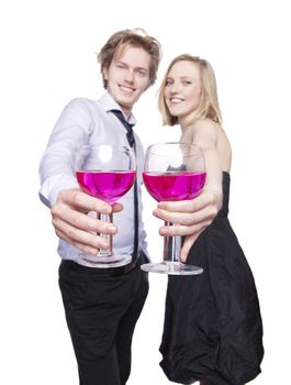 Young couple toasting with pink drink. Selective Focus. Studio photo, isolated.