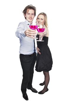 Young couple toasting with pink drink. Two people drinking. Studio photo, isolated.