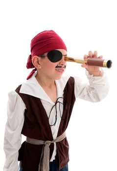 A young boy pirate looking through a monoscope in search of treasure or ships to plunder.  White background.