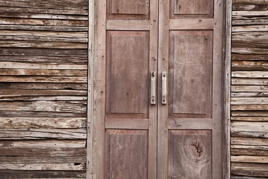 Door and wall made from old solid wood.