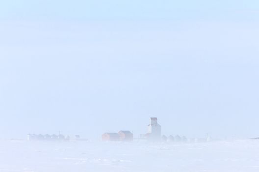 Town and Grain Elevator in Blizzard Saskatchewan 