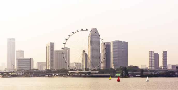Huge ferry wheel in front of a cityscape, Singapore