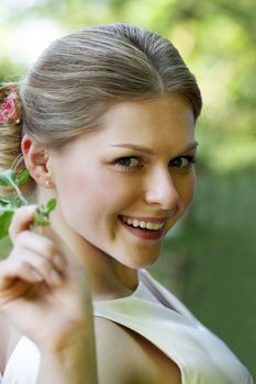 Portrait of the beautiful bride in park