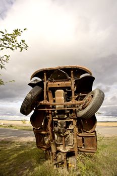 Antique truck sticking out of ground in Saskatchewan Canada