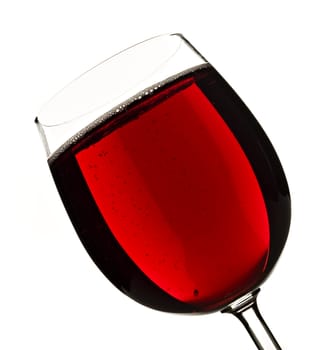 Wine glass with red fruit juice on a white background with space for text