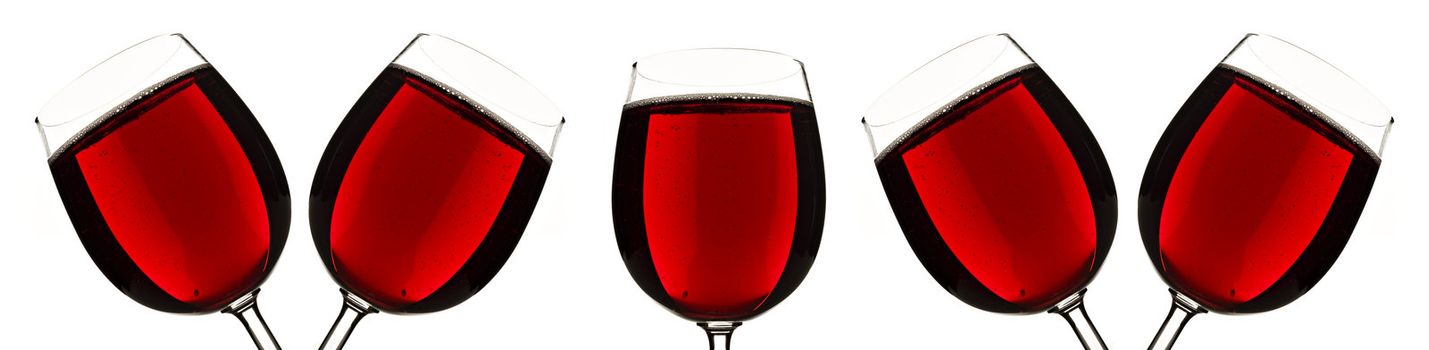 Border of glasses of red fruit juice at close up