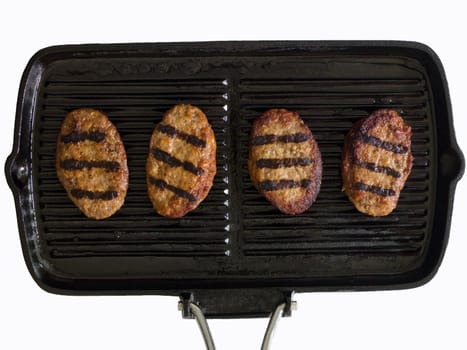 grilled beef patties on a grill