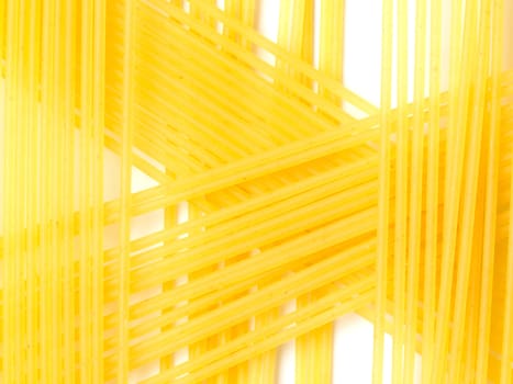 raw spaghetti noodles on white