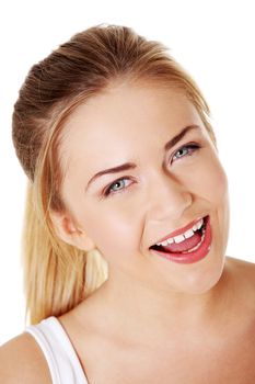 Beautiful young women smiling with open mouth over white background.