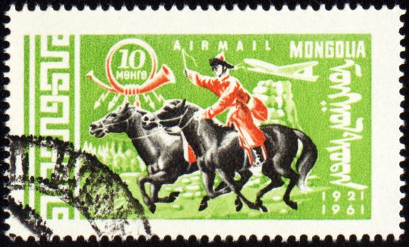 MONGOLIA - CIRCA 1961: stamp printed in Mongolia, shows Mongolian rider on horse, series, circa 1961