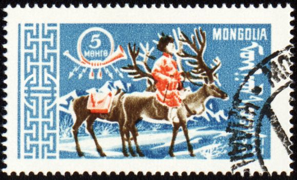 MONGOLIA - CIRCA 1961: stamp printed in Mongolia, shows man with reindeer in winter time, series, circa 1961