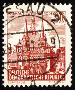 GDR - CIRCA 1960s: A stamp printed in GDR (East Germany) shows Town Hall of old German town Wernigerode, circa 1960s