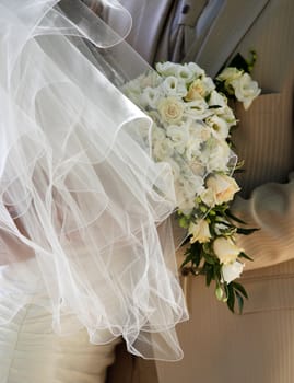 The groom and the bride with a wedding bouquet