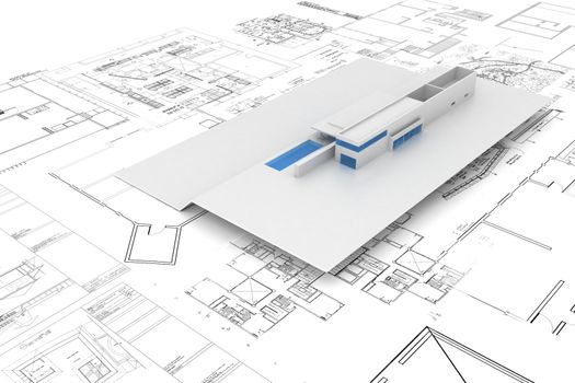 House maquette on top of architecture plans / blueprints