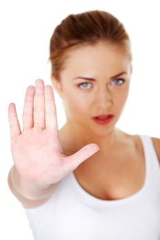 Young pretty caucasian girl showing stop gesture over white background.