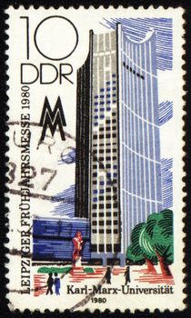GDR - CIRCA 1980: a stamp printed in GDR (East Germany), shows high-rise building of Karl Marx University, circa 1980