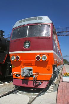 View of  old electric locomotive, standing on  rails, Russia.