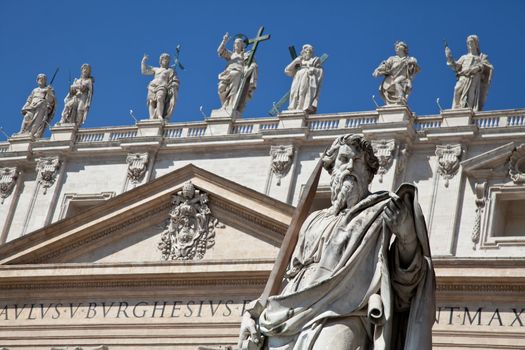 Statues in St. Peter Square (Rome, Italy) with blue sky background