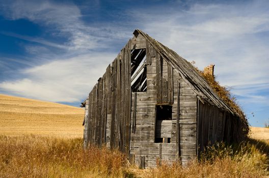 Weathered barn and wispy clouds, Bonneville County, Idaho, USA