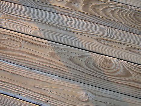 A photograph of wood boards detailing their texture and grain.