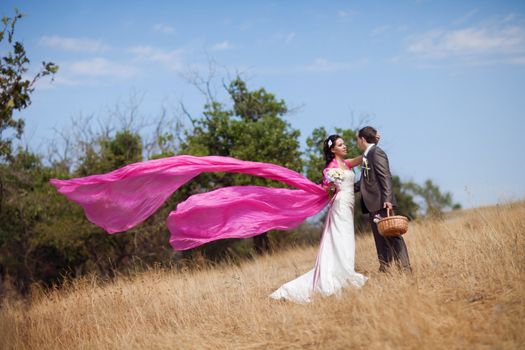 bride and groom with the pink shawl