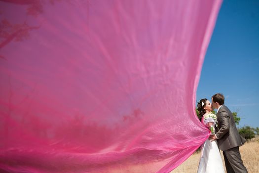 bride and groom with the pink shawl