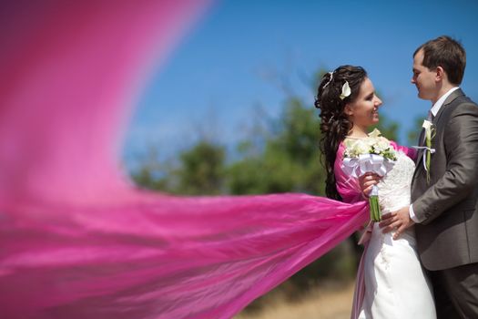 bride and groom with the pink shawl