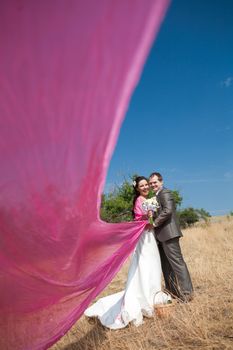 bride and groom with the pink shawl