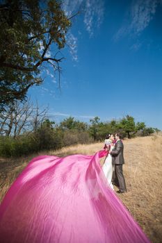 bride and groom with the pink shawl