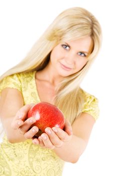 long haired blond girl with an apple