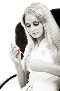black and white image of the girl wit syringe in red