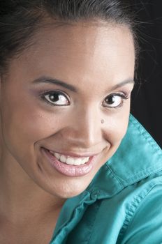 Close-up of a beautiful  African-American woman isolated on black