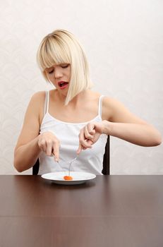 Beautiful caucasian girl eating her diet meal.