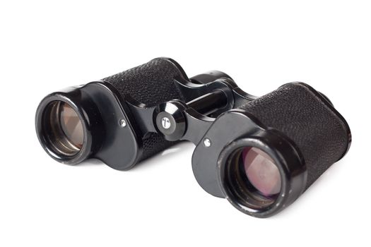Black old binoculars over white background